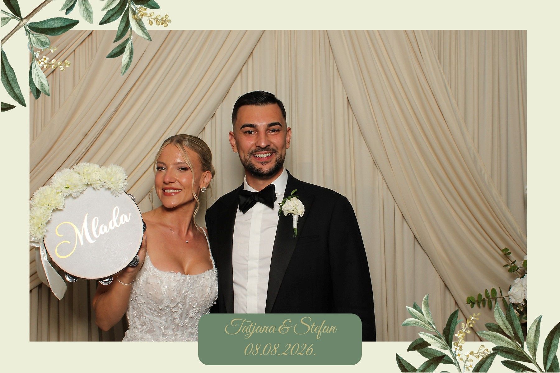 The bride with a prop tambourine at a wedding